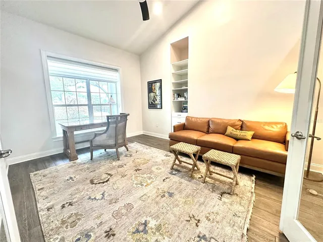 a living room with furniture and a rug