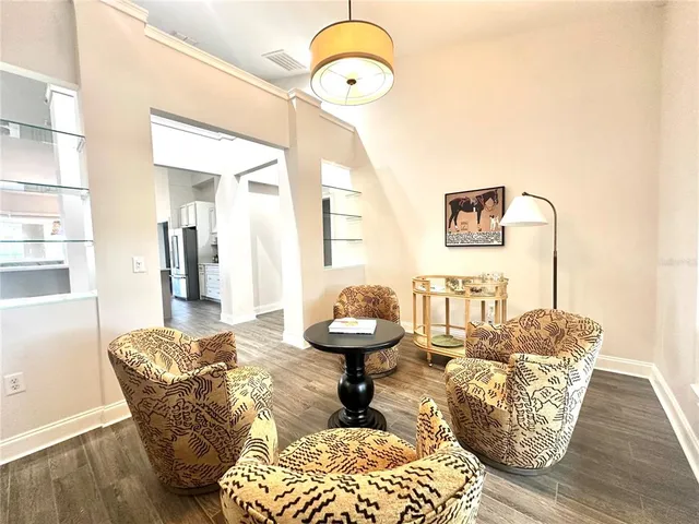 a bedroom with two beds and a couch