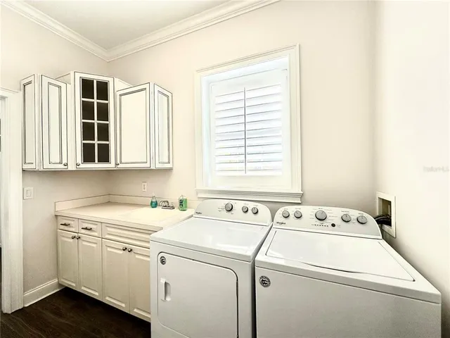 a bathroom with a sink and a window