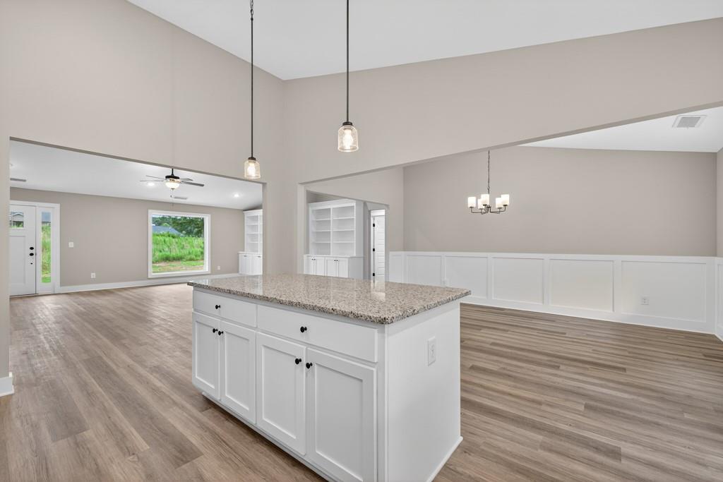 328 Advent Drive Winder, GA 30680 - Photo 12 of 45 a view of a kitchen counter space a wooden floor and window