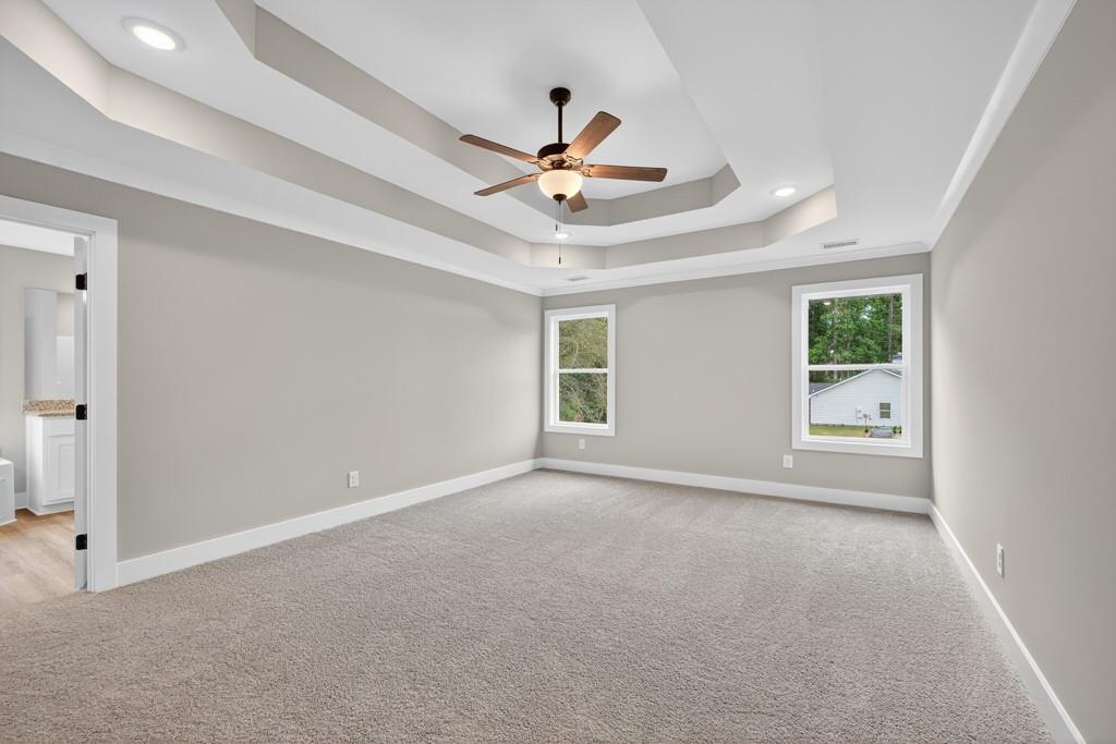 328 Advent Drive Winder, GA 30680 - Photo 16 of 45 an empty room with windows and fan
