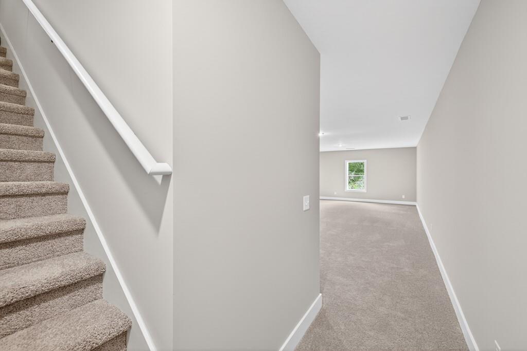 328 Advent Drive Winder, GA 30680 - Photo 33 of 45 a view of a hallway with staircase