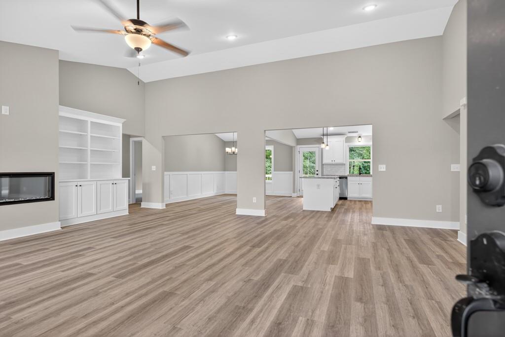 328 Advent Drive Winder, GA 30680 - Photo 5 of 45 a view of empty room with wooden floor and fan