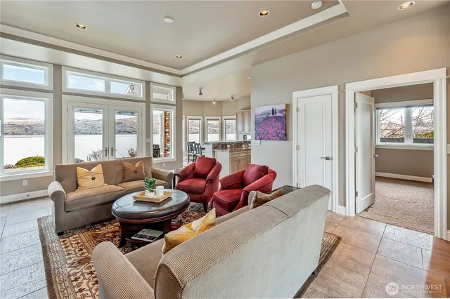 a large kitchen with lots of counter space and furniture