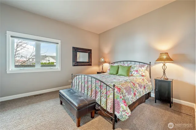 a view of a dining room with furniture large windows and wooden floor