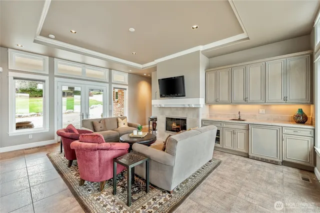 a kitchen with stainless steel appliances granite countertop a refrigerator sink and stove