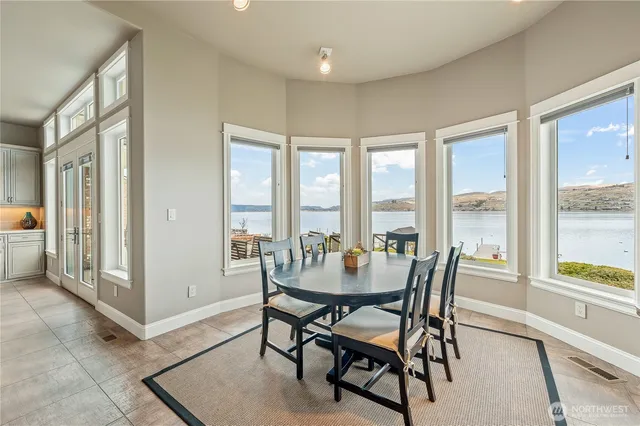 a kitchen with a refrigerator and cabinets
