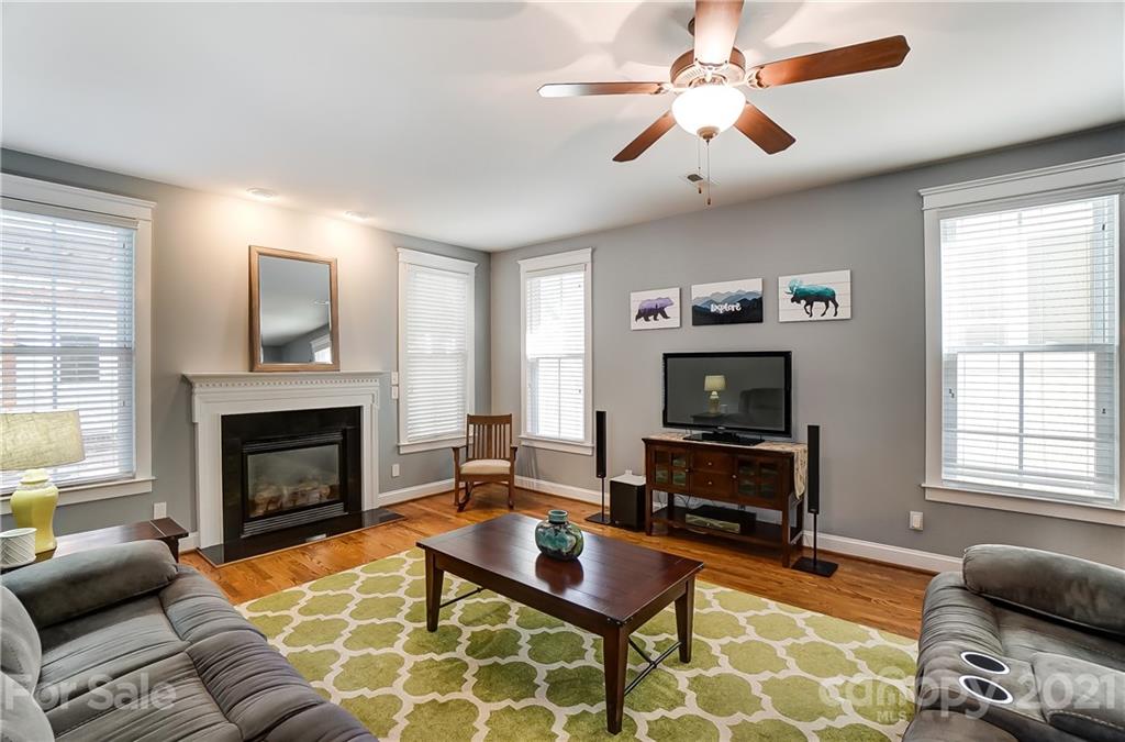 3555 Richard's Crossing Fort Mill, SC 29708 - Photo 18 of 37 a living room with furniture a flat screen tv and a fireplace