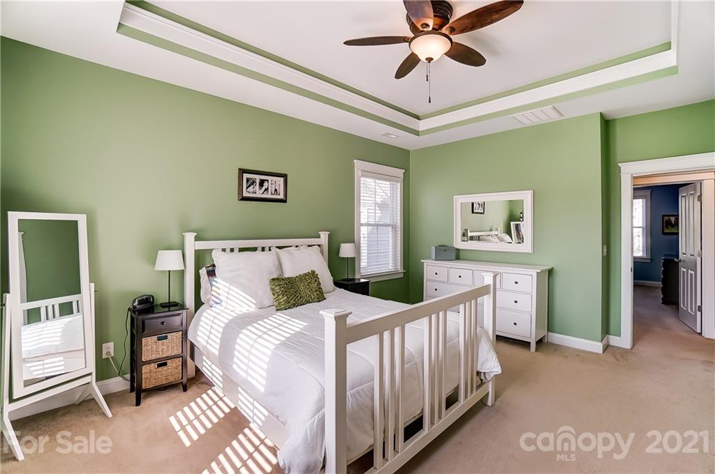 3555 Richard's Crossing Fort Mill, SC 29708 - Photo 23 of 37 a bedroom with a bed and a chandelier