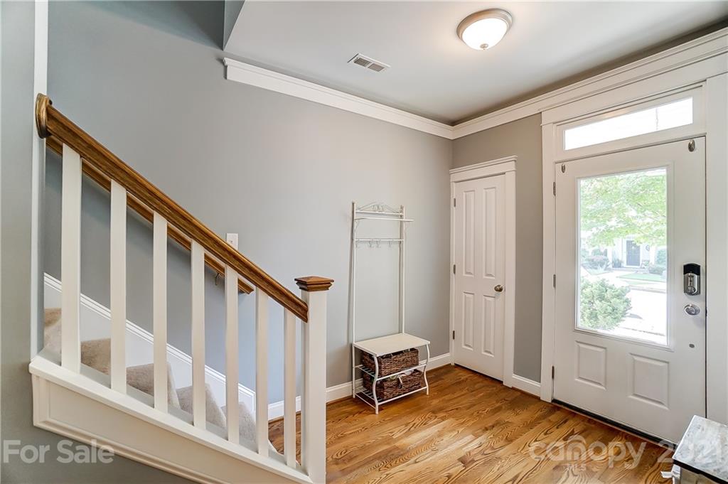 3555 Richard's Crossing Fort Mill, SC 29708 - Photo 5 of 37 a view of an entryway with wooden floor and windows