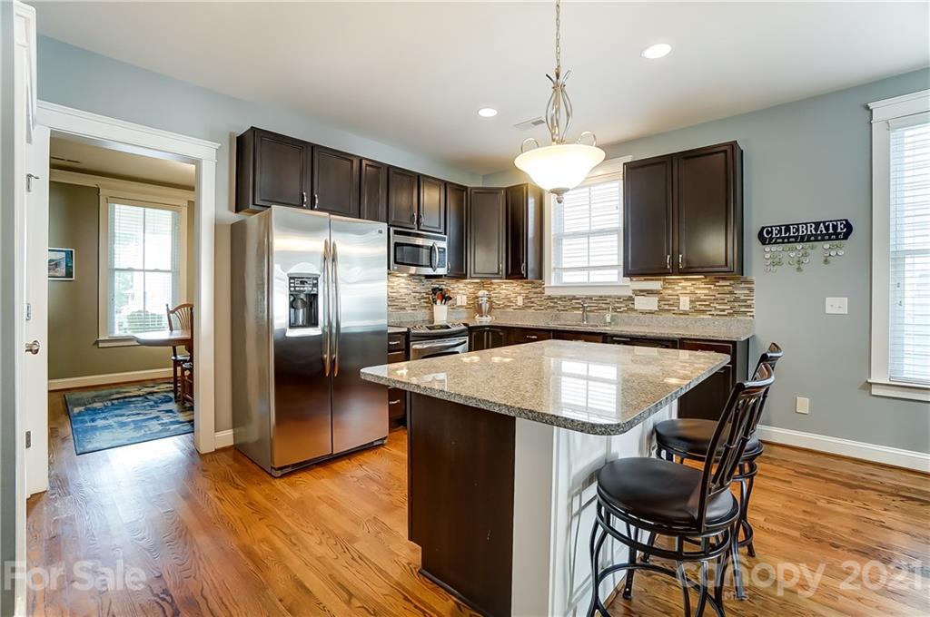 3555 Richard's Crossing Fort Mill, SC 29708 - Photo 10 of 37 a kitchen with stainless steel appliances granite countertop counter space a sink refrigerator and cabinets