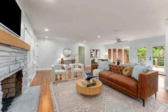 a living room with furniture and a fireplace