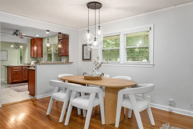 a dining room with furniture and window