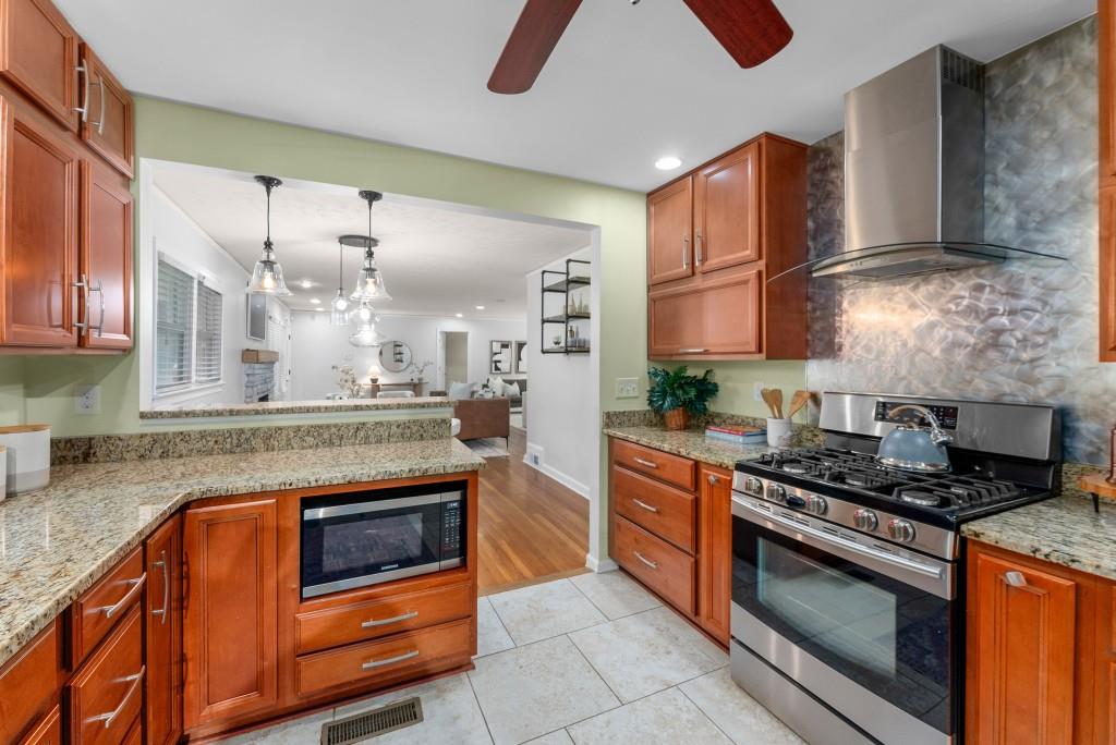 1865 Briarlake Circle Decatur, GA 30033 - Photo 15 of 32 a kitchen with stainless steel appliances granite countertop a stove and a sink