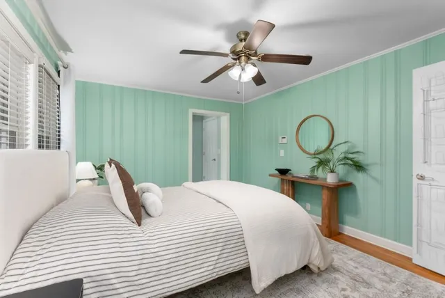 a bedroom with a bed and window