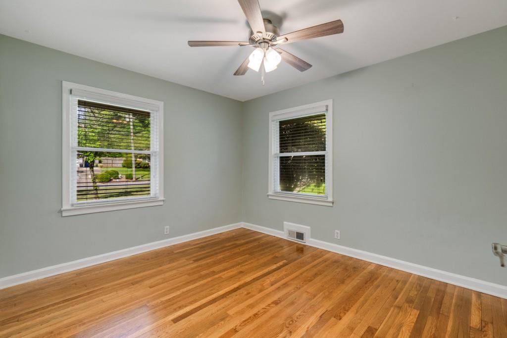 1865 Briarlake Circle Decatur, GA 30033 - Photo 23 of 32 a view of an empty room with a window and wooden floor