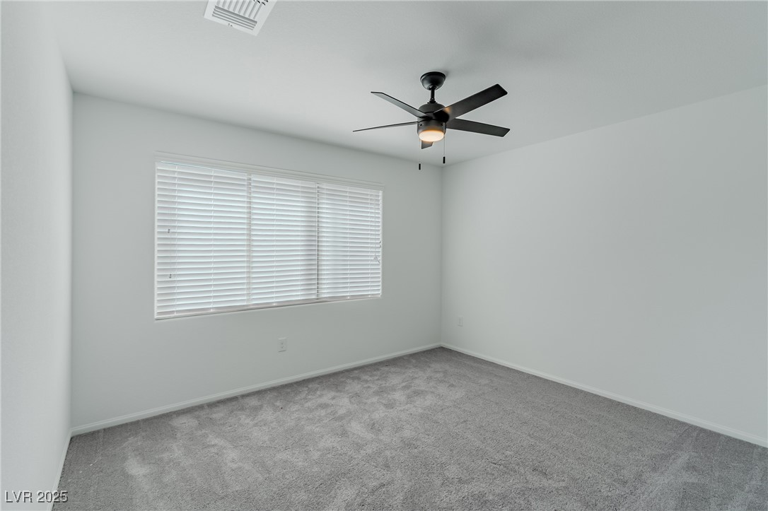 7859 Lacemaker Court Las Vegas, NV 89113 - Photo 14 of 24 Unfurnished room featuring carpet and a ceiling fan