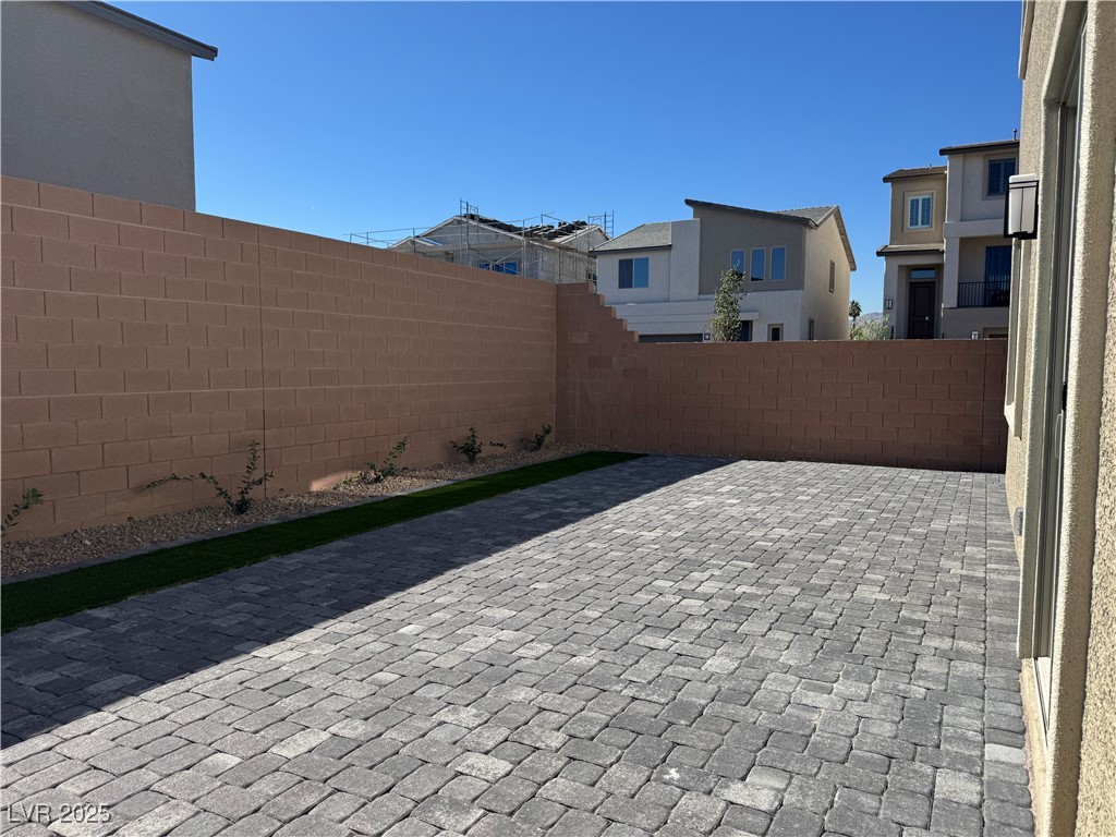 7859 Lacemaker Court Las Vegas, NV 89113 - Photo 22 of 24 Fenced backyard with a patio