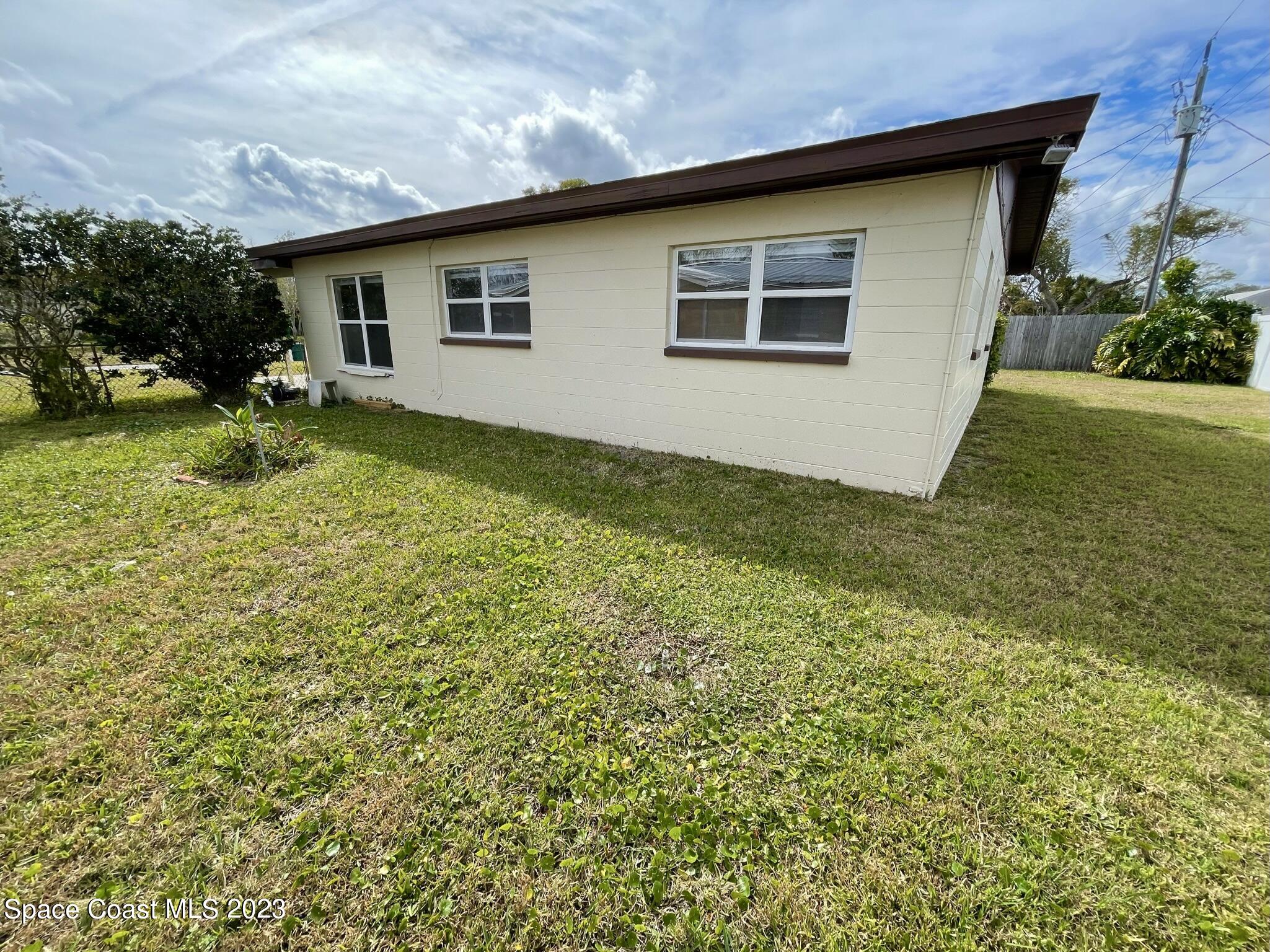 1820 Harrison Avenue Melbourne, FL 32935 - Photo 18 of 20 a house view with a backyard space