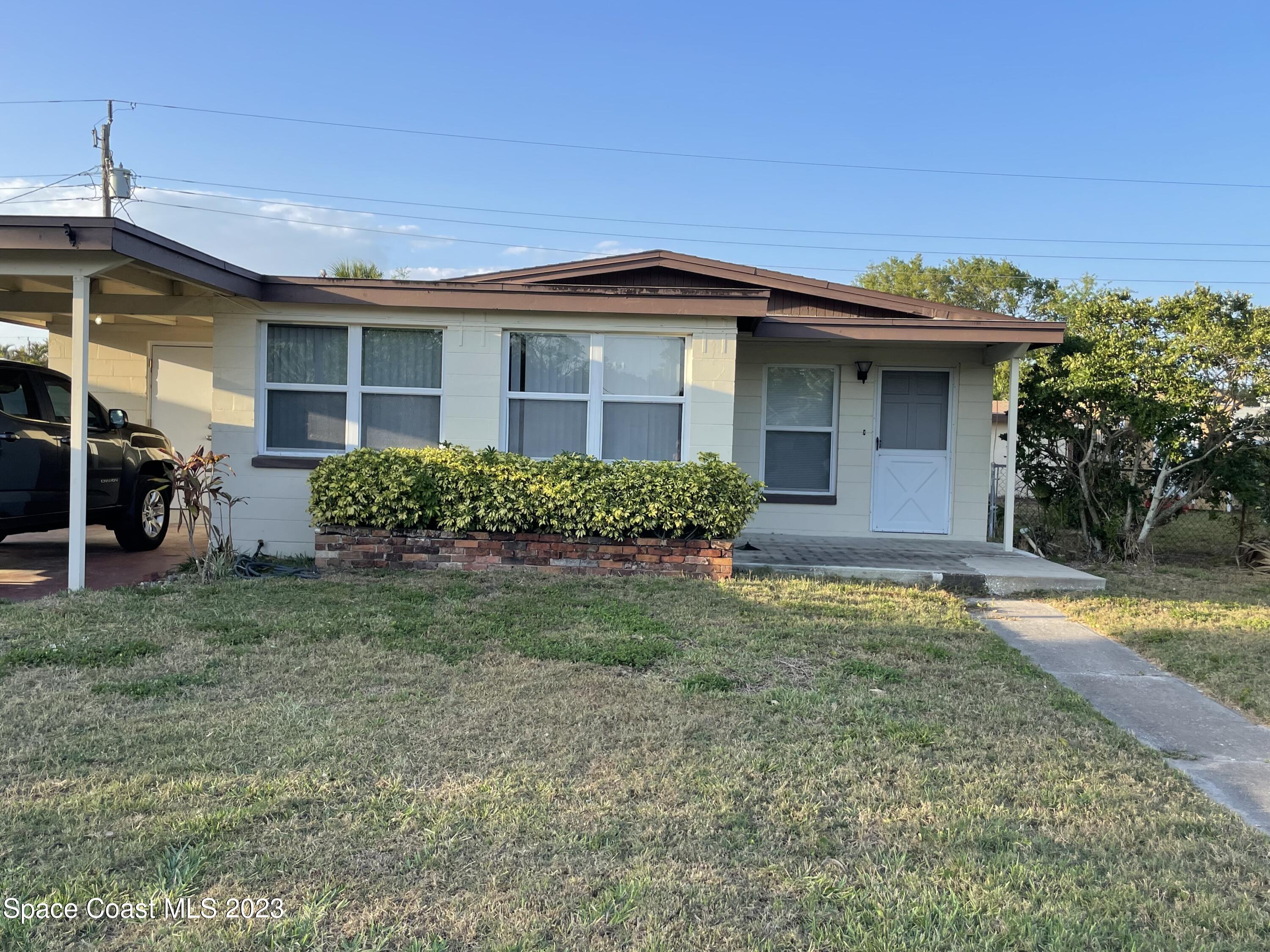 1820 Harrison Avenue Melbourne, FL 32935 - Photo 2 of 20 a view of a house with yard and plants