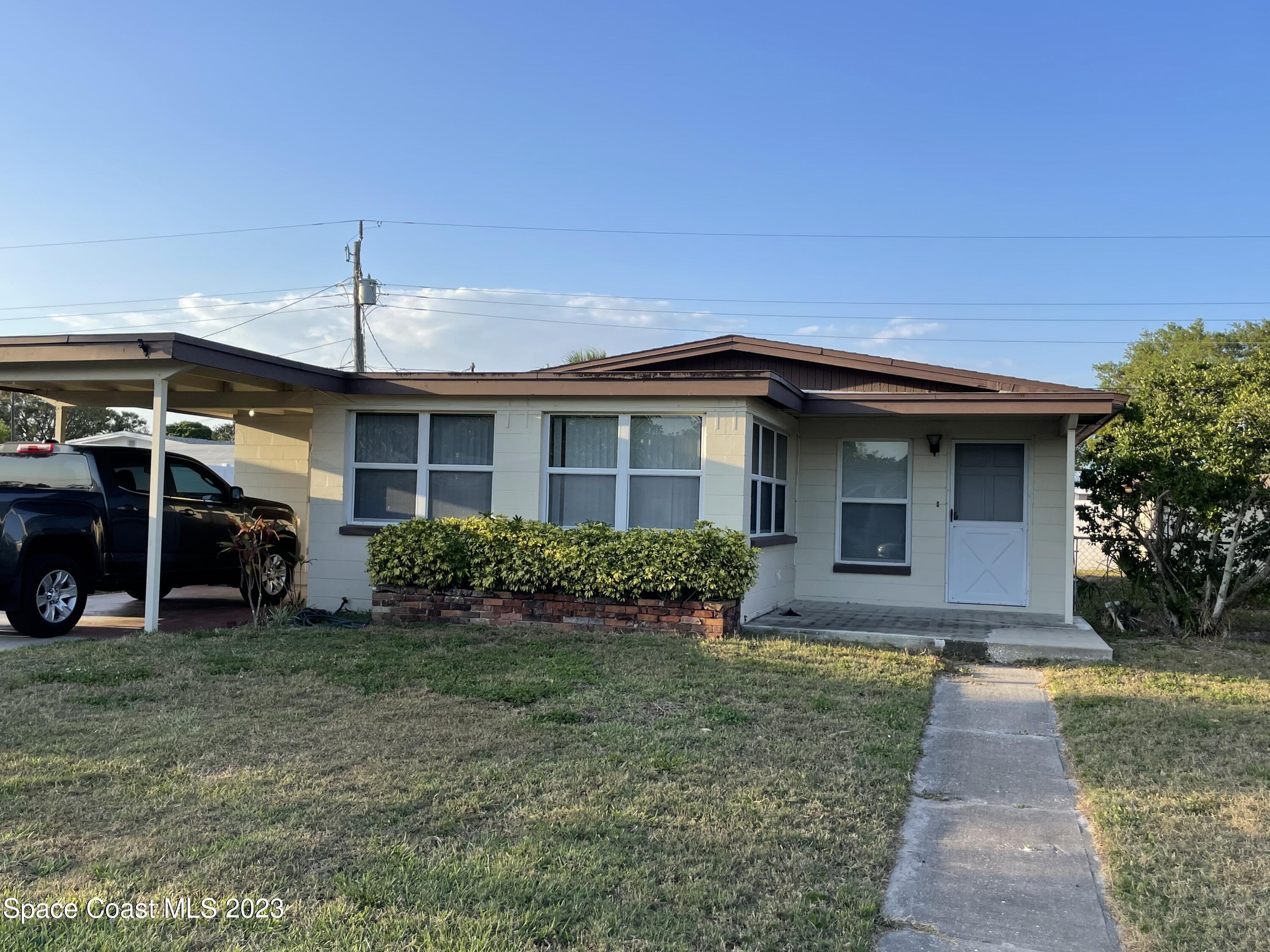 1820 Harrison Avenue Melbourne, FL 32935 - Photo 3 of 20 a front view of house with yard and green space