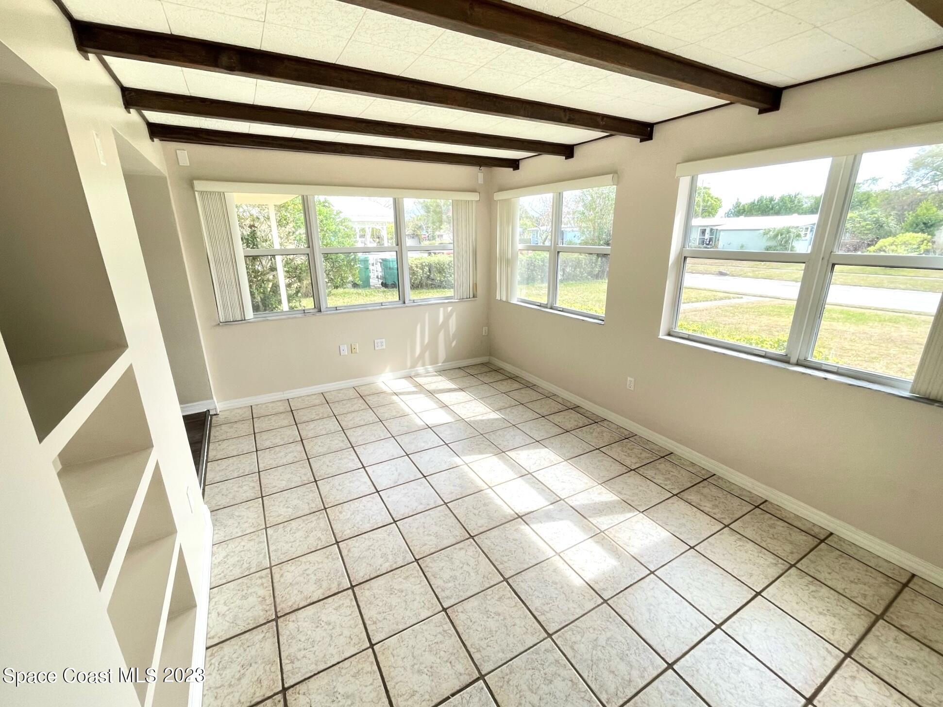 1820 Harrison Avenue Melbourne, FL 32935 - Photo 6 of 20 a view of an empty room with windows