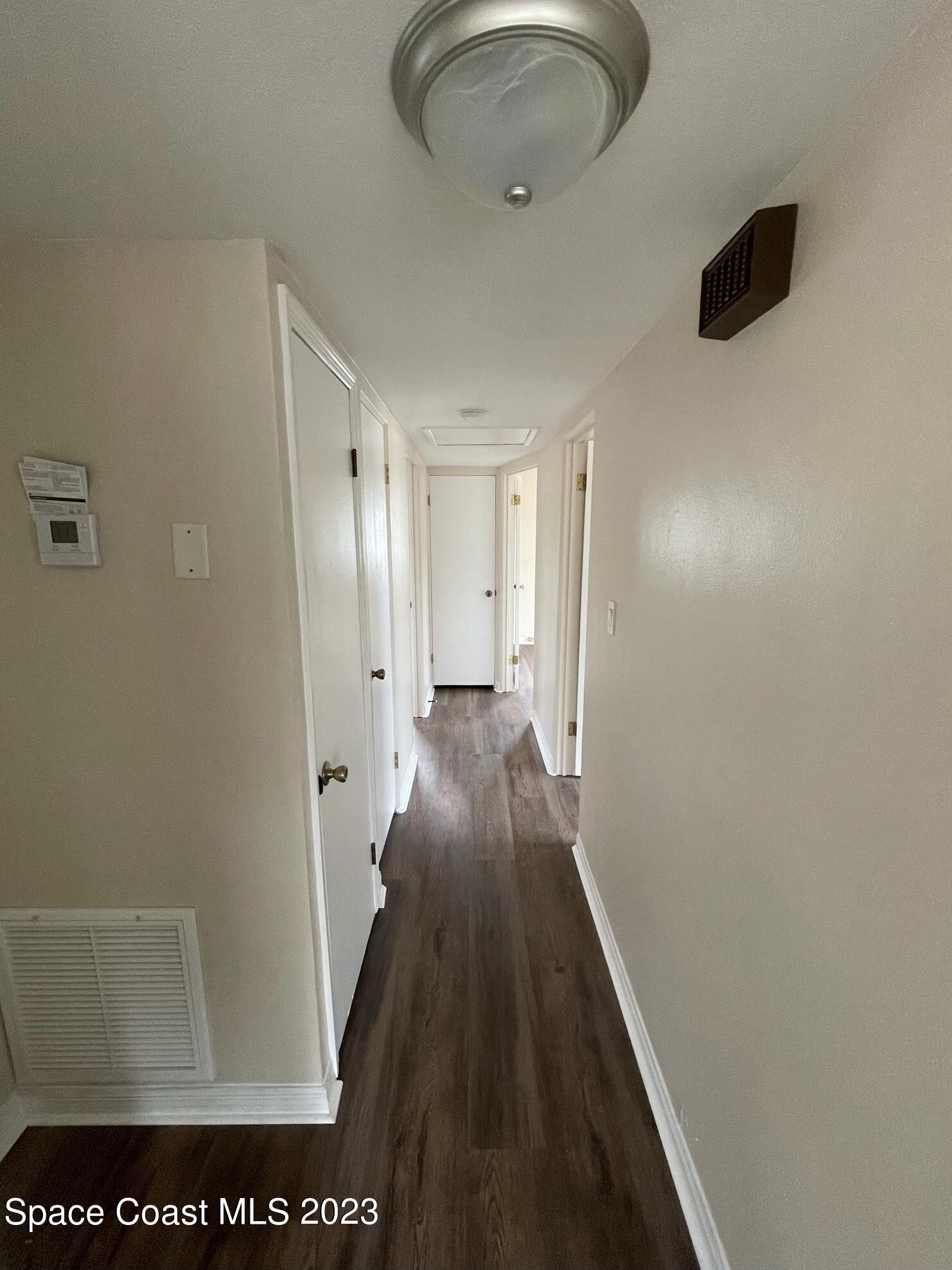 1820 Harrison Avenue Melbourne, FL 32935 - Photo 10 of 20 a view of a hallway with wooden floor