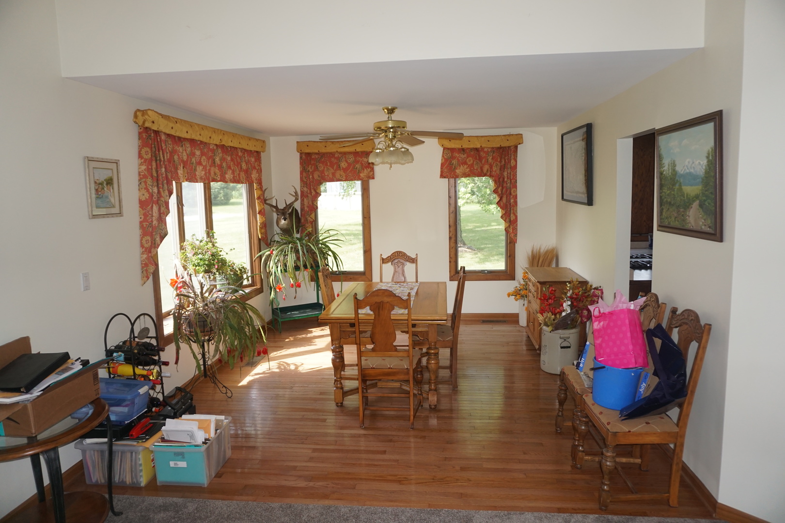 4914 Highway 113 Kankakee, IL 60901 - Photo 16 of 54 a living room with fireplace furniture and a wooden floor