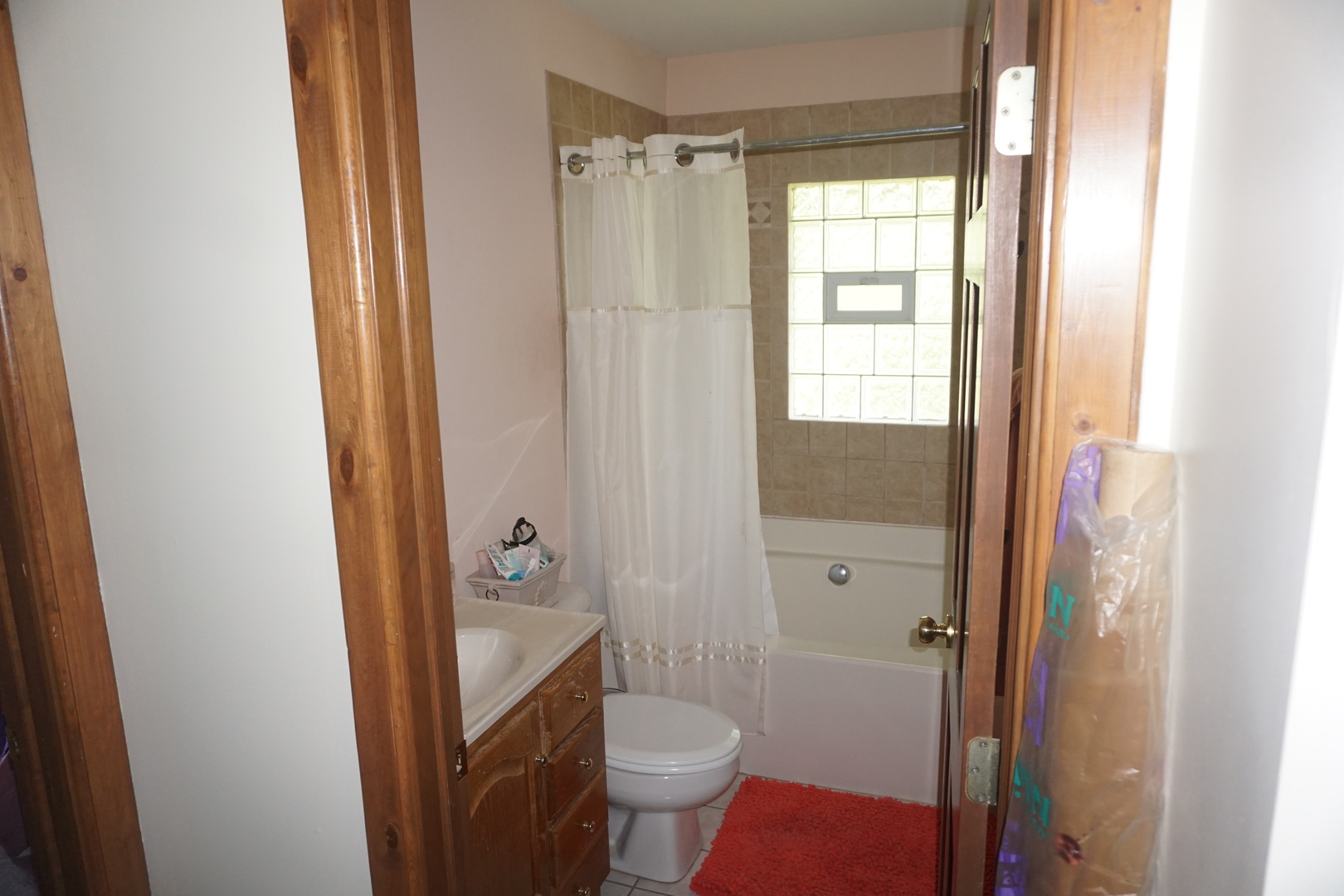4914 Highway 113 Kankakee, IL 60901 - Photo 25 of 54 a bathroom with a granite countertop toilet a sink and a mirror