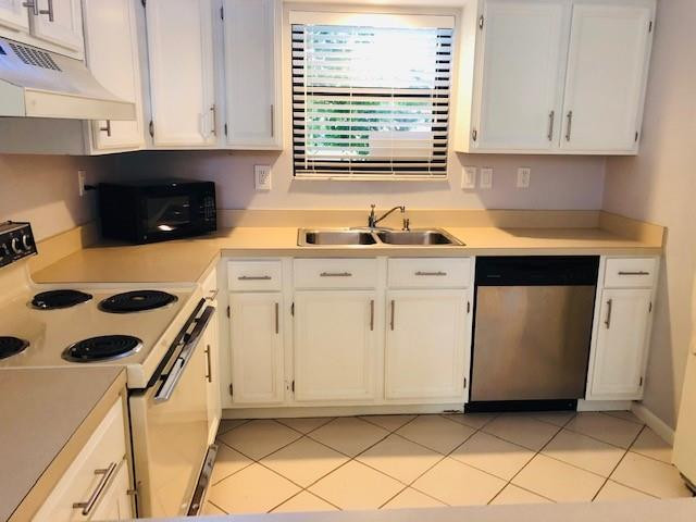 9301 Southwest 130th Street Miami, FL 33176 - Photo 8 of 13 a kitchen with a stove a sink and a microwave