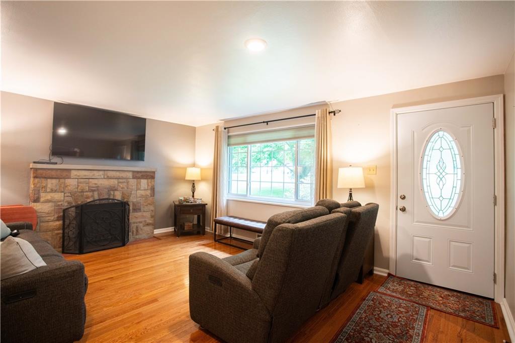 490 Barclay Hill Road Beaver, PA 15009 - Photo 11 of 26 a living room with furniture a fireplace and a flat screen tv