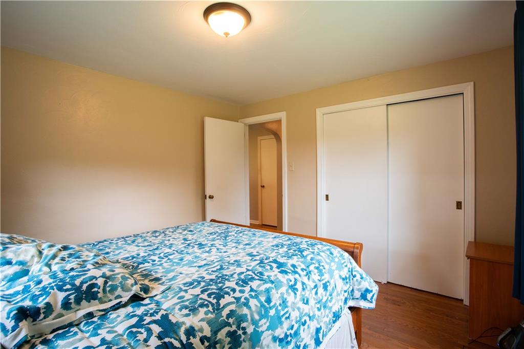 490 Barclay Hill Road Beaver, PA 15009 - Photo 13 of 26 a bedroom with a bed and wooden floor