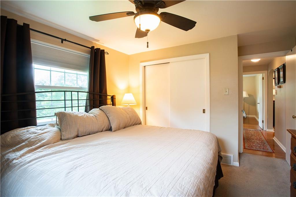 490 Barclay Hill Road Beaver, PA 15009 - Photo 15 of 26 a bedroom with a bed lamp and a large window