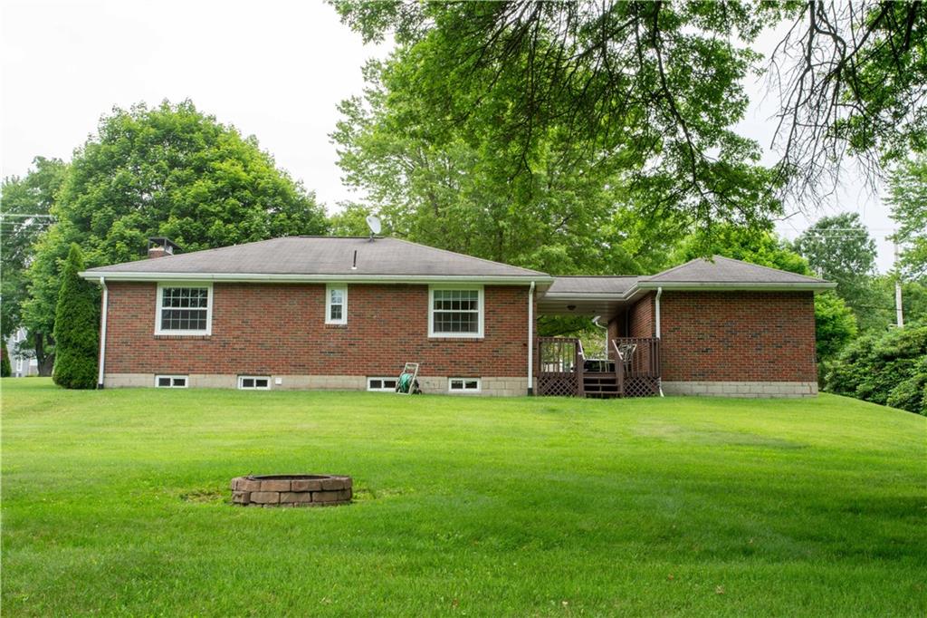 490 Barclay Hill Road Beaver, PA 15009 - Photo 24 of 26 a backyard of a house with table and chairs