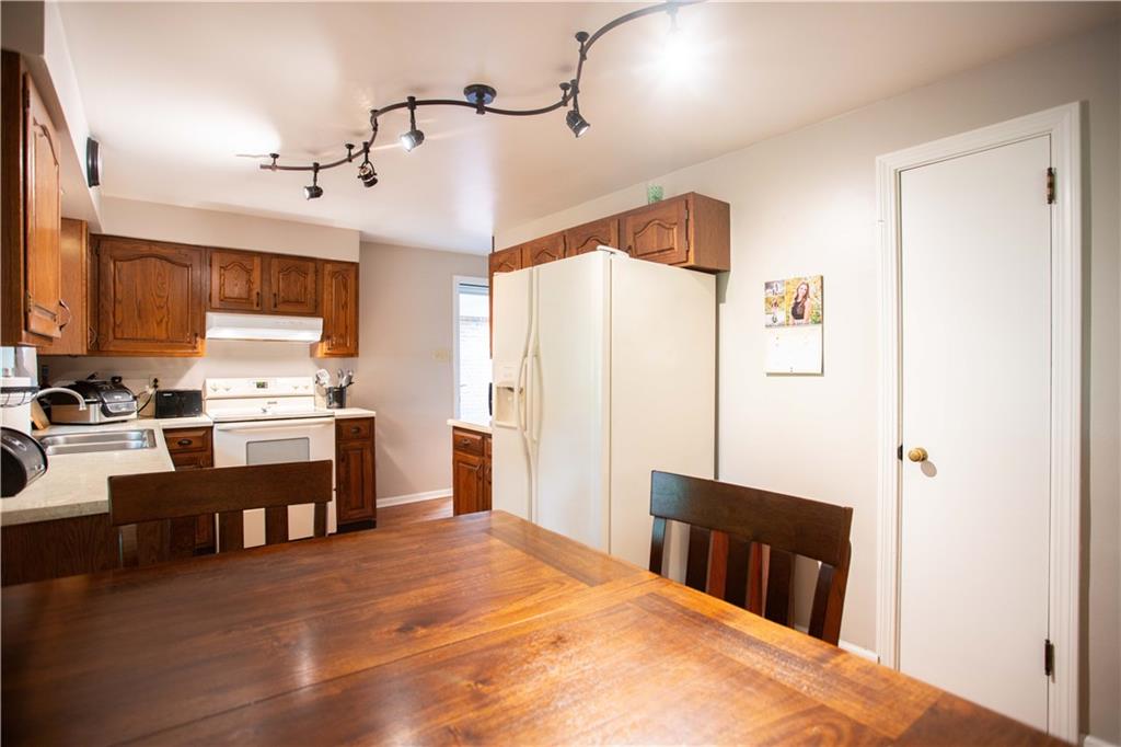 490 Barclay Hill Road Beaver, PA 15009 - Photo 5 of 26 a kitchen with stainless steel appliances a refrigerator and a stove top oven