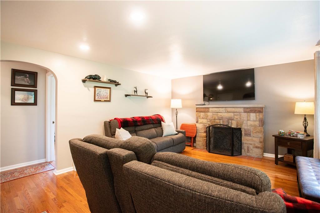 490 Barclay Hill Road Beaver, PA 15009 - Photo 10 of 26 a living room with furniture a fireplace and a flat screen tv