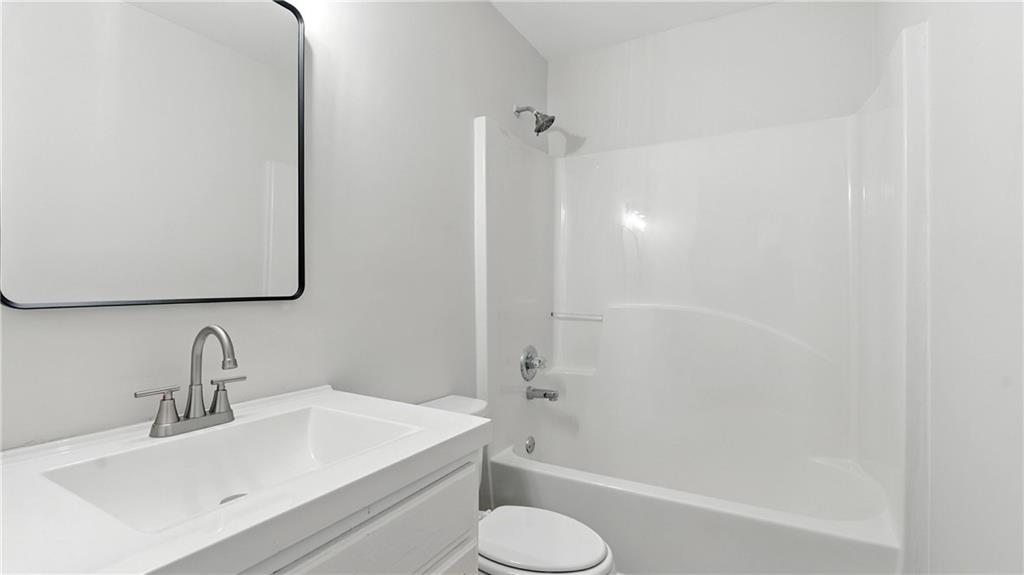 730 Reeves Lake Drive Southwest Marietta, GA 30064 - Photo 11 of 16 a bathroom with a sink toilet and shower