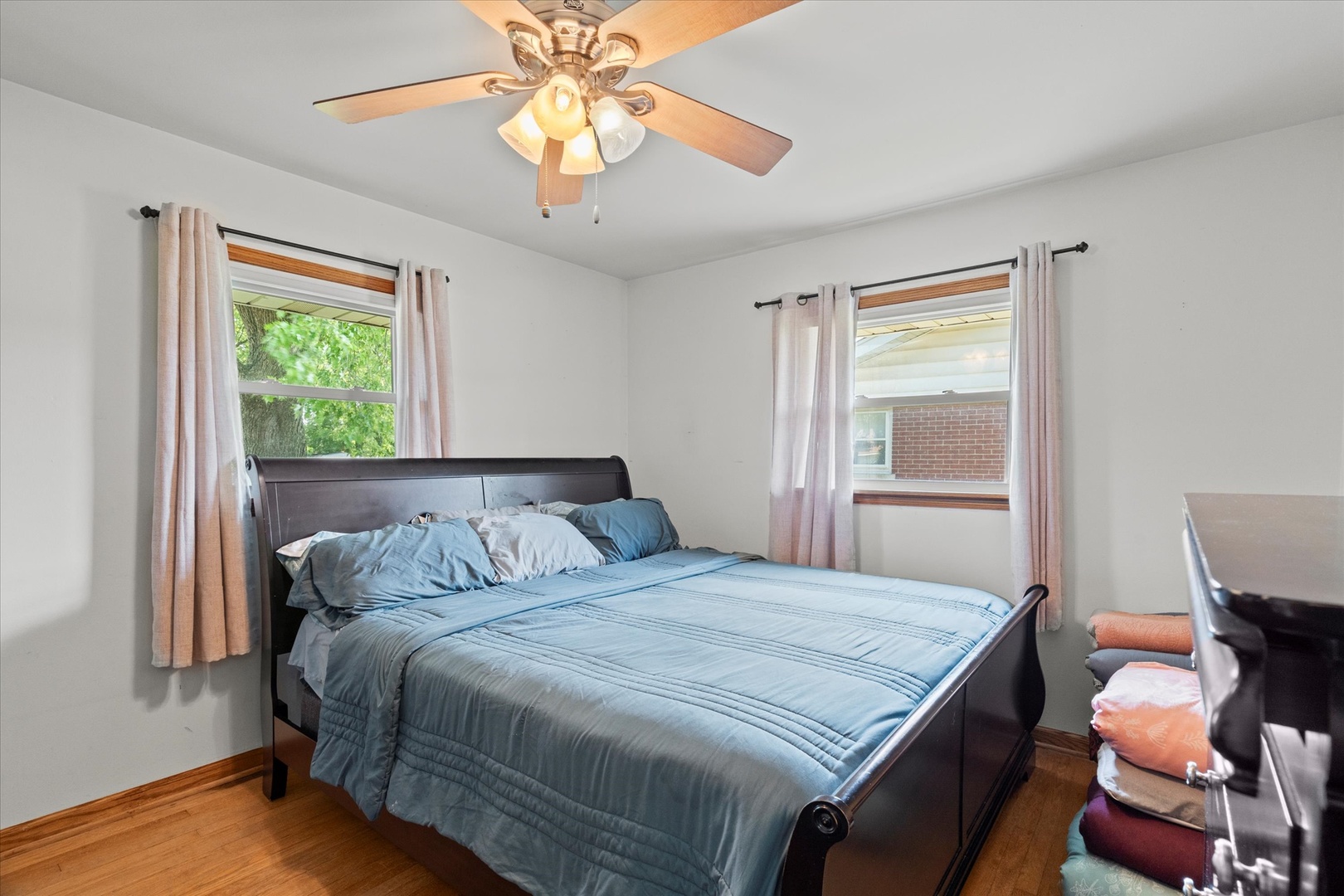 5661 Roosevelt Street Monee, IL 60449 - Photo 11 of 20 a bedroom with a bed and a chandelier