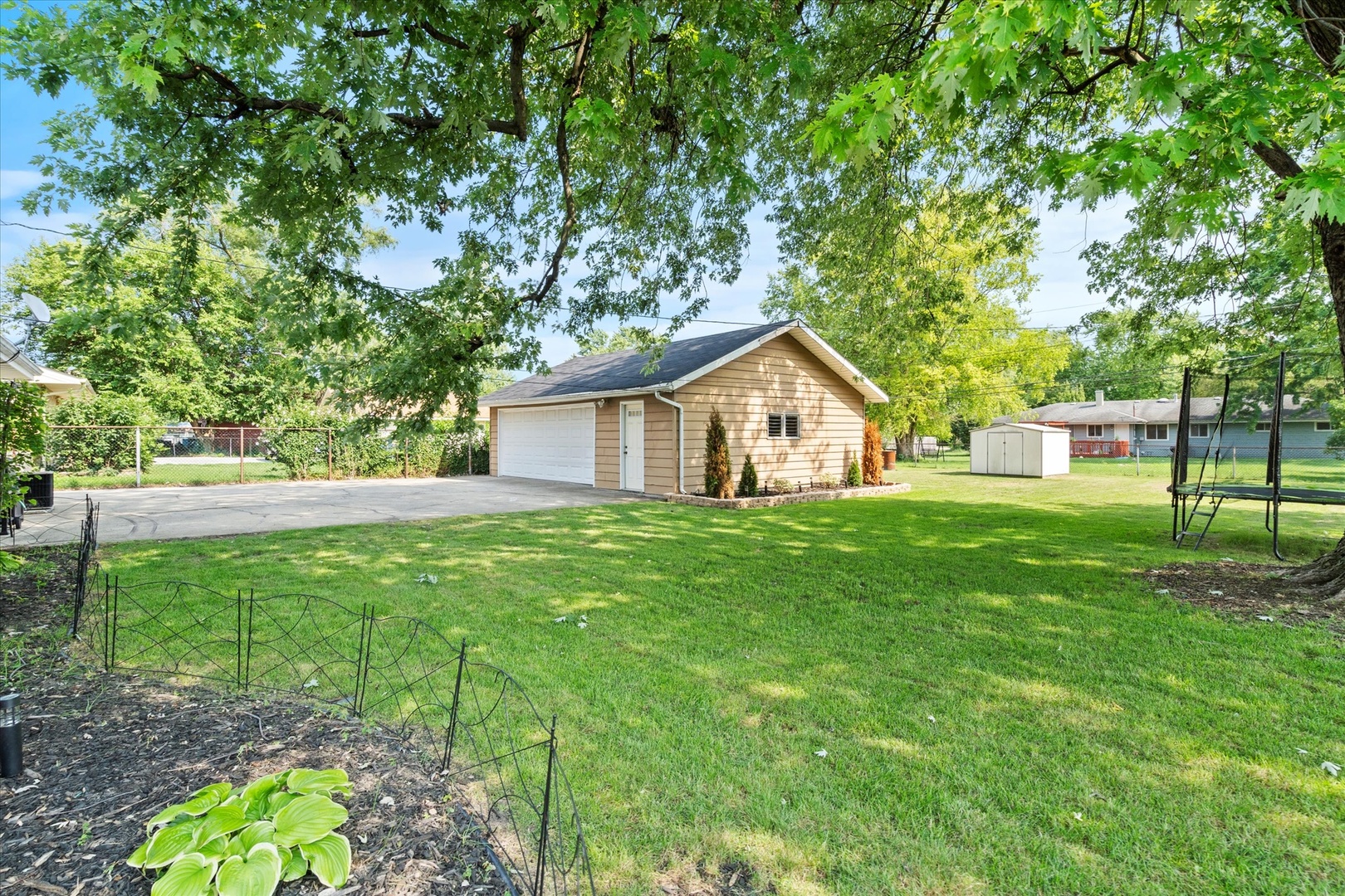 5661 Roosevelt Street Monee, IL 60449 - Photo 17 of 20 a view of a house with backyard and garden