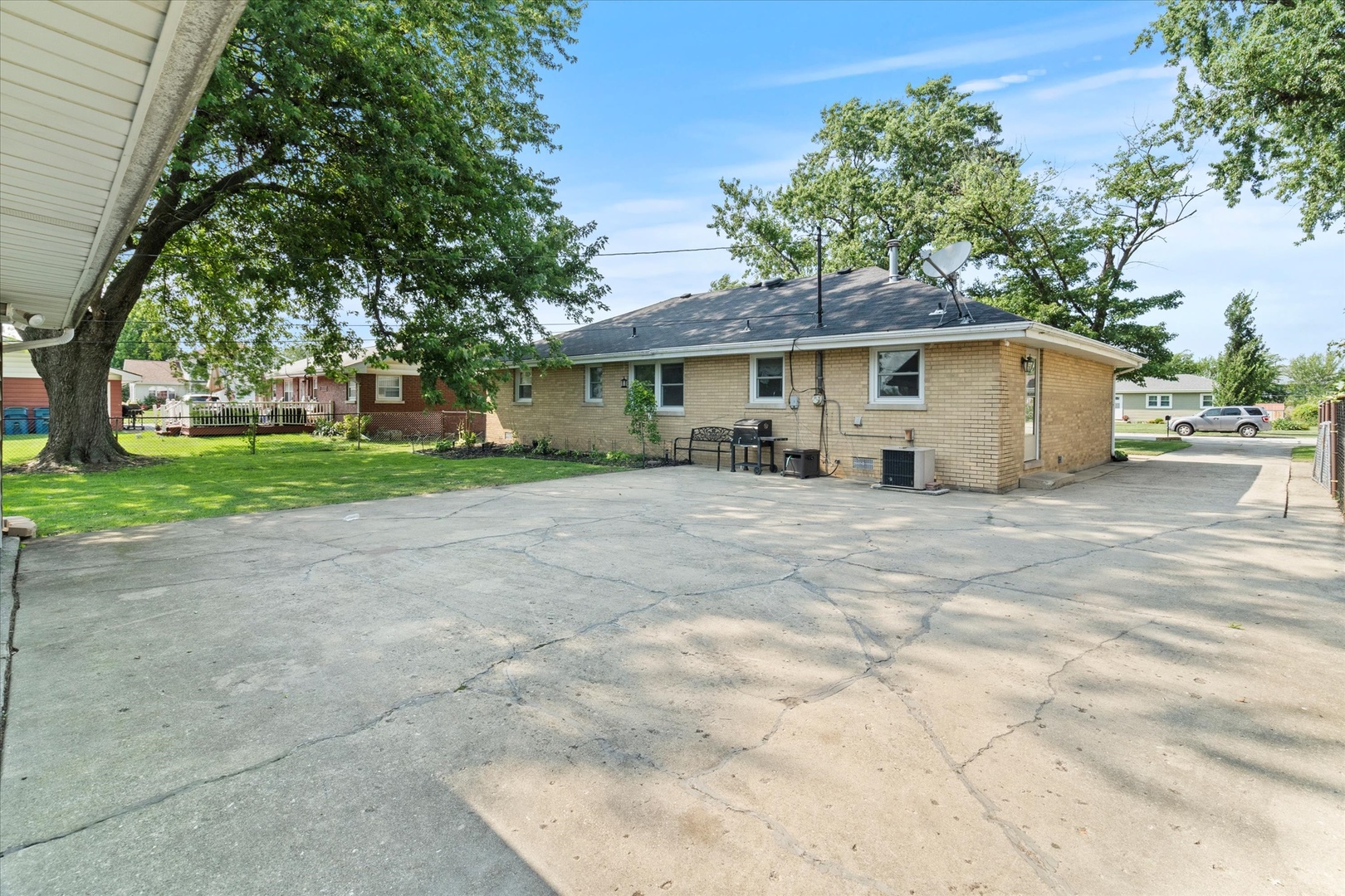 5661 Roosevelt Street Monee, IL 60449 - Photo 19 of 20 a view of a house with a yard and large trees