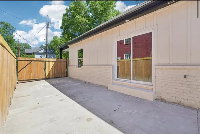 a bedroom with a bed and a potted plant