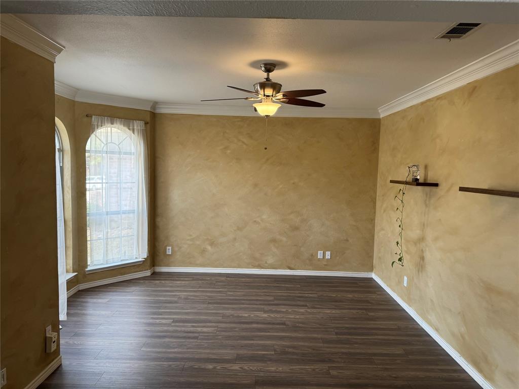 3448 Lark Meadow Way Dallas, TX 75287 - Photo 11 of 39 wooden floor in an empty room with a window