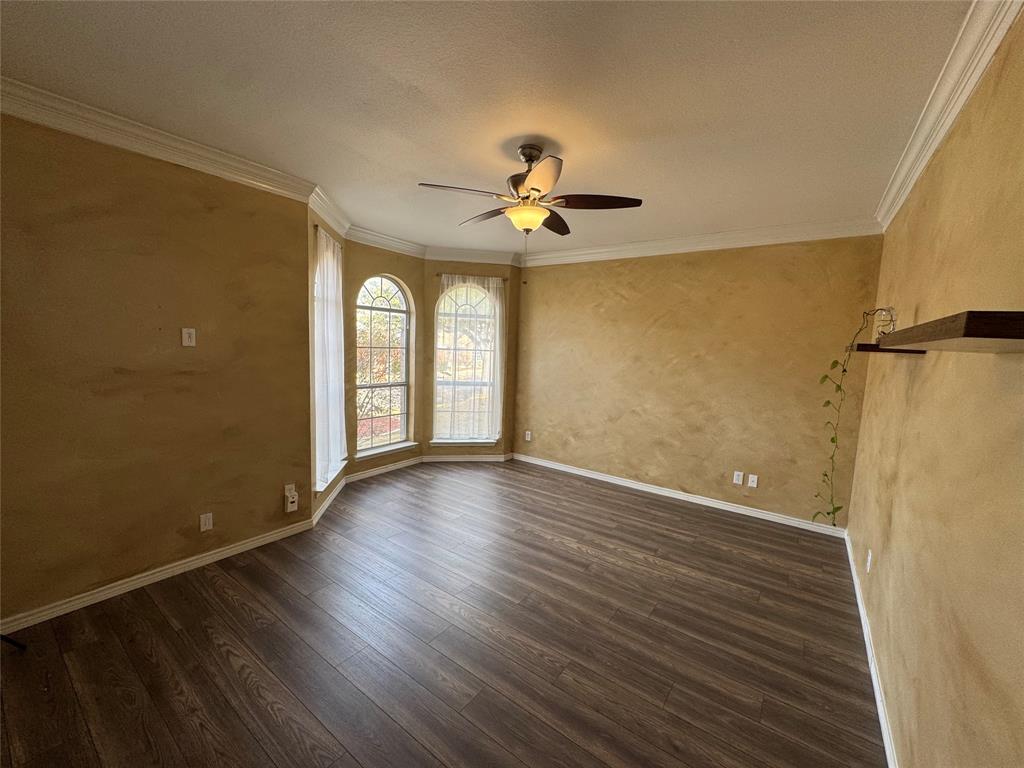 3448 Lark Meadow Way Dallas, TX 75287 - Photo 14 of 39 wooden floor in an empty room with a window