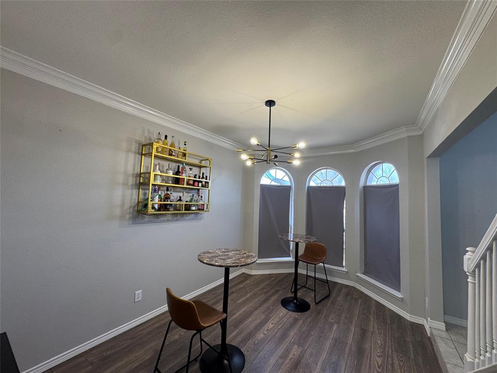 3448 Lark Meadow Way Dallas, TX 75287 - Photo 20 of 39 a view of a room with furniture and wooden floor