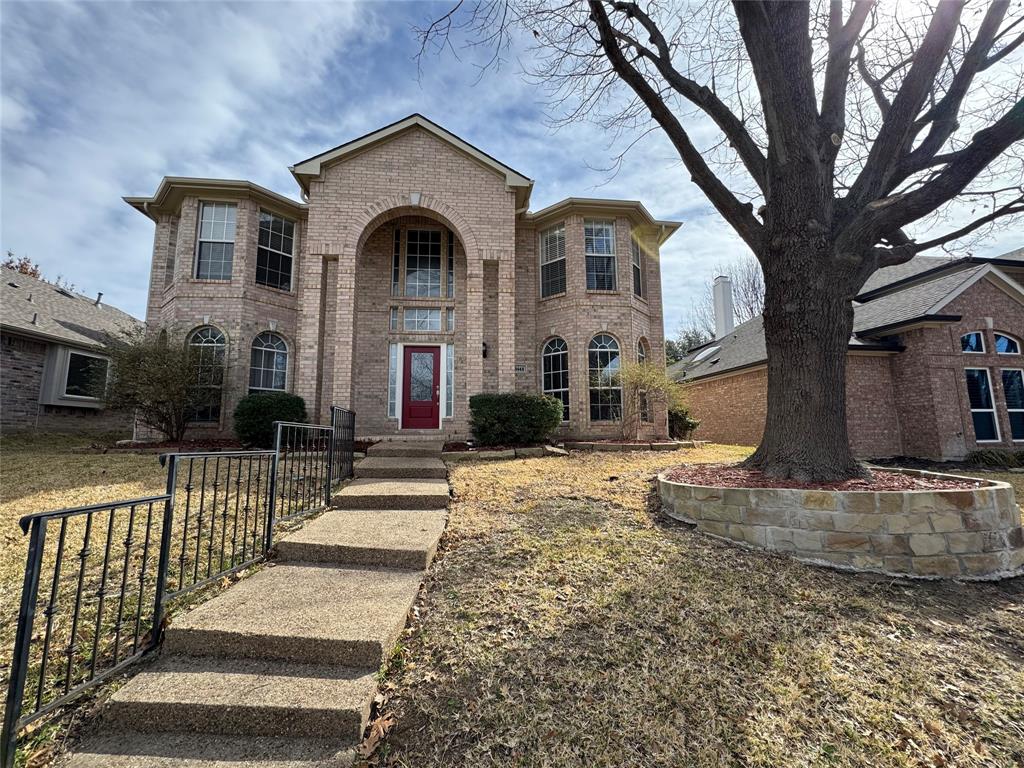 3448 Lark Meadow Way Dallas, TX 75287 - Photo 2 of 39 a front view of a house with a yard