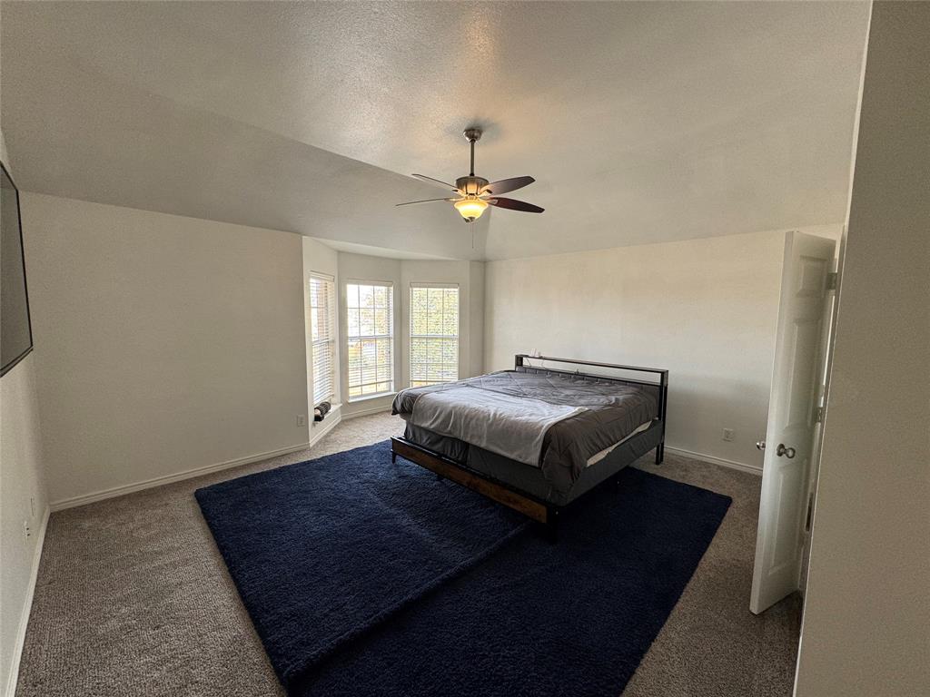 3448 Lark Meadow Way Dallas, TX 75287 - Photo 28 of 39 a bedroom with a bed and a window