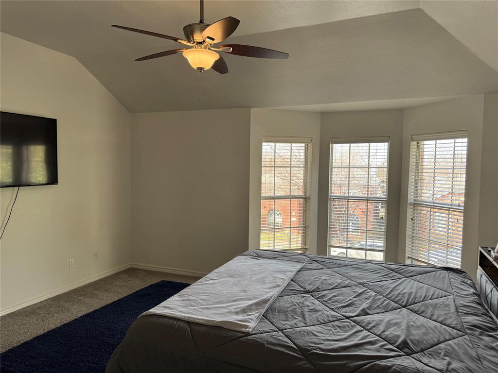 3448 Lark Meadow Way Dallas, TX 75287 - Photo 29 of 39 a bedroom with a bed and a window