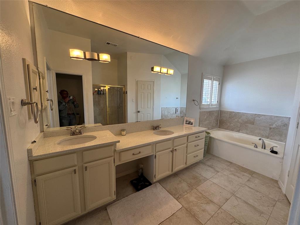 3448 Lark Meadow Way Dallas, TX 75287 - Photo 32 of 39 a large white bathroom with a large tub sink vanity and granite
