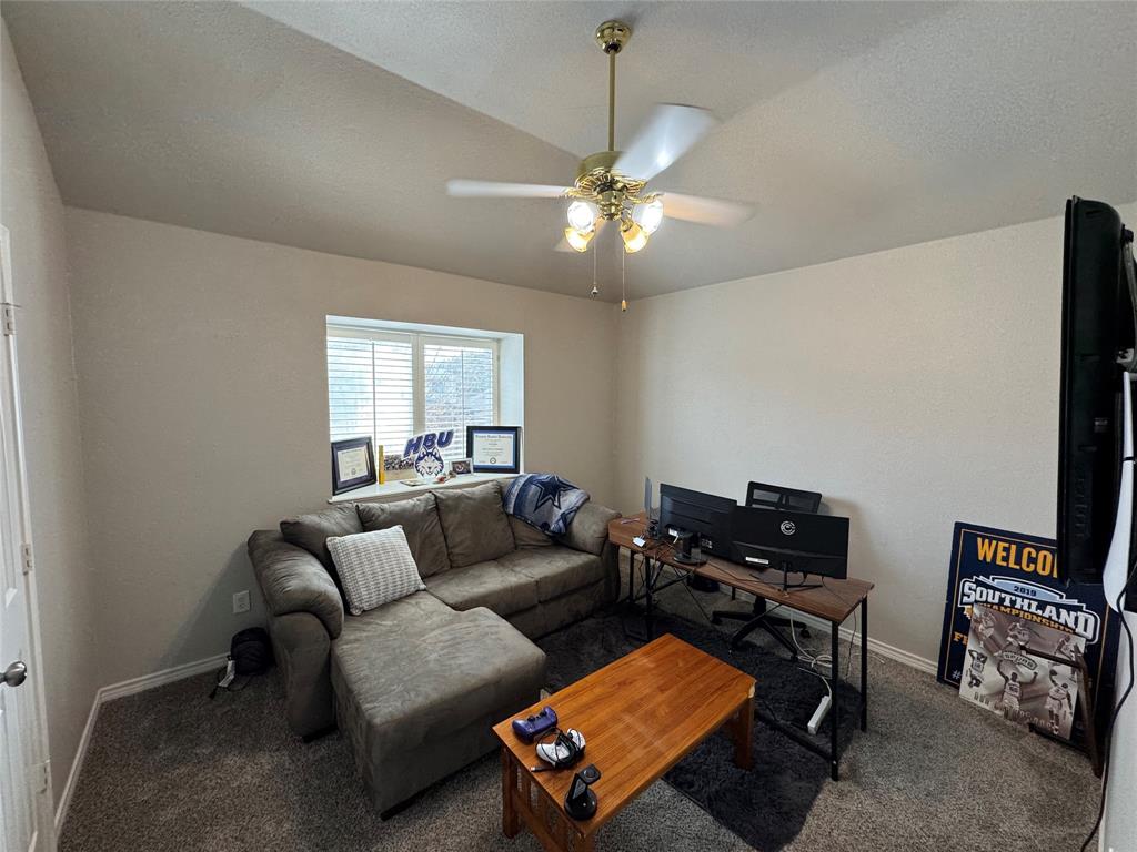3448 Lark Meadow Way Dallas, TX 75287 - Photo 33 of 39 a living room with furniture and a ceiling fan