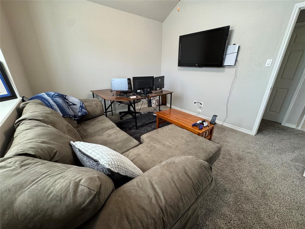 3448 Lark Meadow Way Dallas, TX 75287 - Photo 34 of 39 a living room with furniture and a flat screen tv